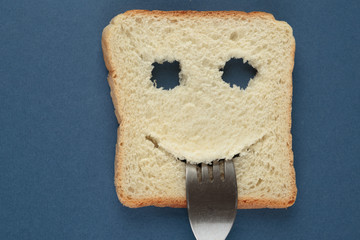 Happy toast with a fork in her mouth