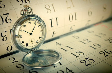 Old pocket watch and calendar