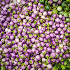 Fresh eggplants and for sale at asian market. Organic food background