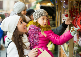 Family of four buying holidays decorations