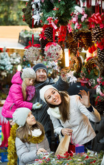 Family standing at coniferous souvenirs counter
