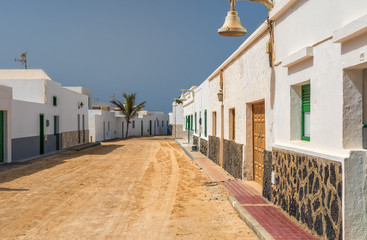 Sandy alleyway between the houses on the island of La Graciosa.