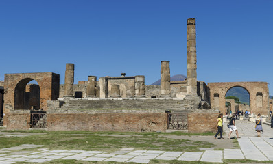 The tourists visiting the Forum and Temple of Jupiter . Pompeii © BlackMac