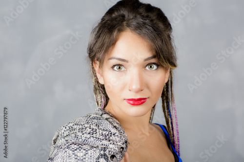 Woman Portrait With Colorful Dreadlocks Is A Studio Hippie