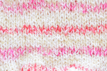 Pink knitted background for baby girl.