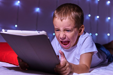 Portrait of a child with a tablet computer