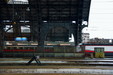 Naklejka premium Trains come to central railway station of Milan