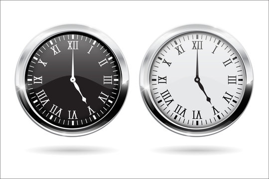 Clock. Black and white clock face with roman numerals and chrome frame