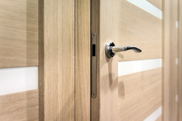Part of open door with silver door-handle