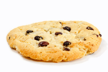 Cookies with raisins and chocolate lying on white background.
