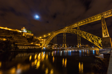 Fototapeta na wymiar Long exposure night view of Dom Luís I Bridge in Porto, Portugal