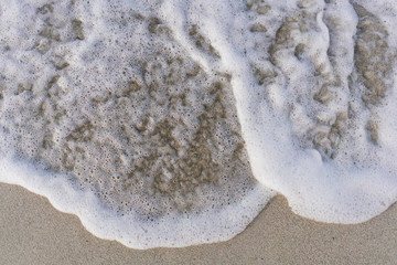 The sand and ocean surf on the beaches