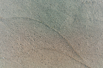 The sand and ocean surf on the beaches