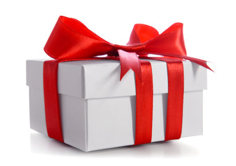 Gift box decorated with red ribbon and big bow isolated on white