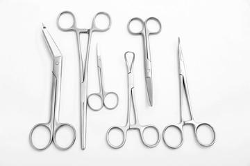 Flat lay of medical instruments on white background