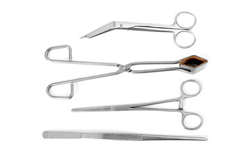 Flat lay of medical instruments on white background