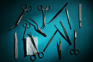 Flat lay of medical instruments on blue background