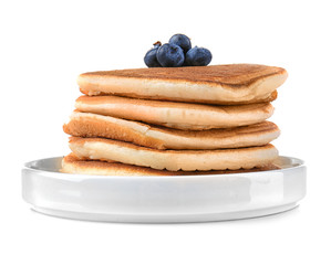Tasty pancakes with blueberries on plate, isolated on white