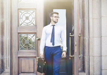 Handsome young lawyer  leaving building