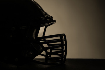 Fototapeta na wymiar Rugby helmets on dark background
