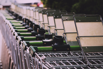 BEACONSFIELD, ENGLAND - JUNE 2016: Waitrose shopping trollies ou