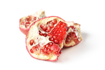 Ripe pomegranate fruit isolated on white background