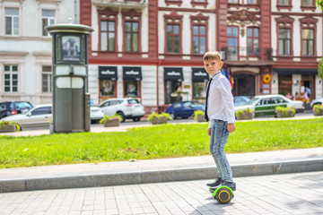 Young boy getting onto a hover board