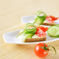 Canapes on plate. Close-up.