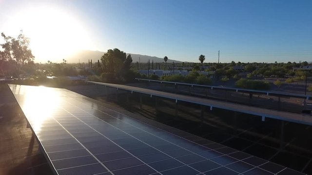 Aerial flyover of a solar panel covered parking lot