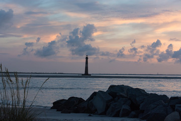 Lighthouse sunrise.  Island scenery.  Folly Beach, South Carolina.  