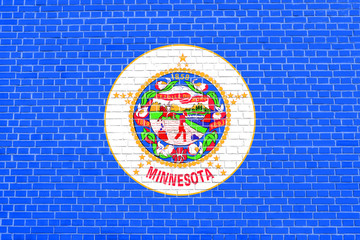 Flag of Minnesota on brick wall texture background