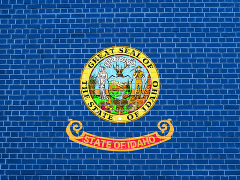 Flag of Idaho on brick wall texture background