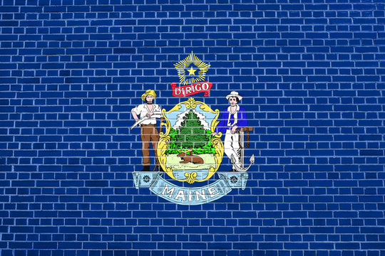 Flag of Maine on brick wall texture background
