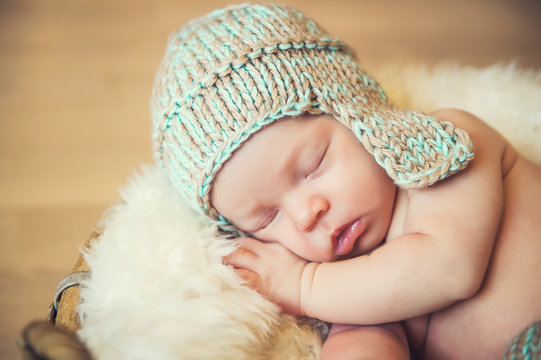 Sleeping newborn baby in a basket