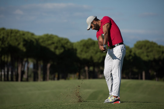 golf player hitting long shot