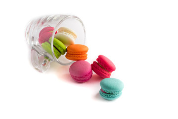 French macarons colorful on glass cup with white background, swe