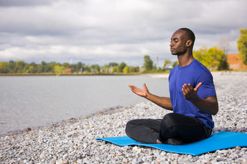 young man exercising yoga