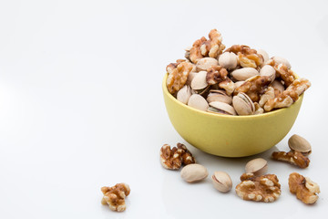 Walnuts and pistachios mixed in a bowl.