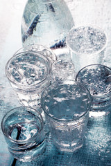 Composition of water glasses in the rain. Water concept 