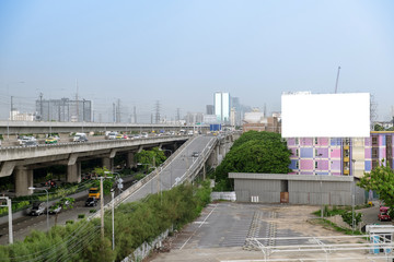 Fototapeta na wymiar Traffic capital city cloudy with large billboard