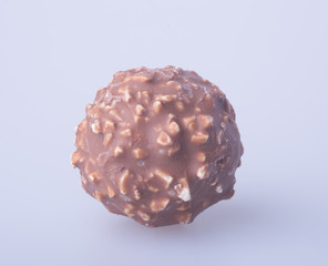 chocolate ball or chocolate bonbon on a background.