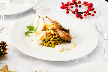 quail with salad on Christmas table