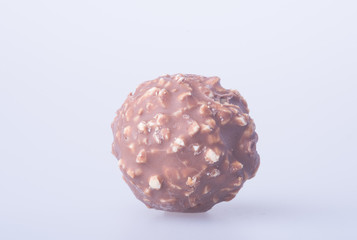 chocolate ball or chocolate bonbon on a background.