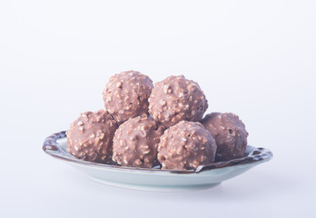 chocolate ball or chocolate bonbon on a background.