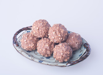chocolate ball or chocolate bonbon on a background.