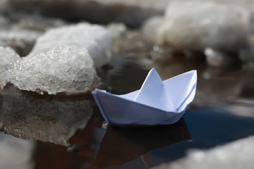 paper boat in a pool