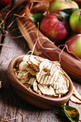 Healthy food: apple chips and fresh apples, decorations in the r