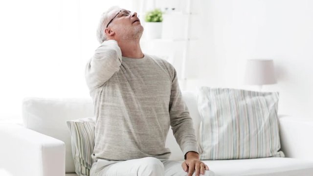 senior man suffering from headache at home 136