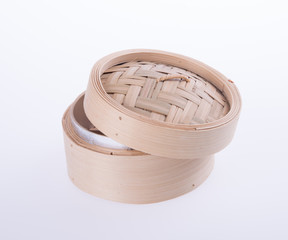 Bamboo steamer or dim sum steamer on background.