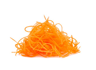 Close up of fresh shredded carrots on a white background.